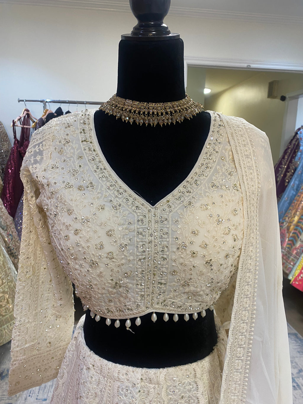 Full sleeve cream color lehenga choli