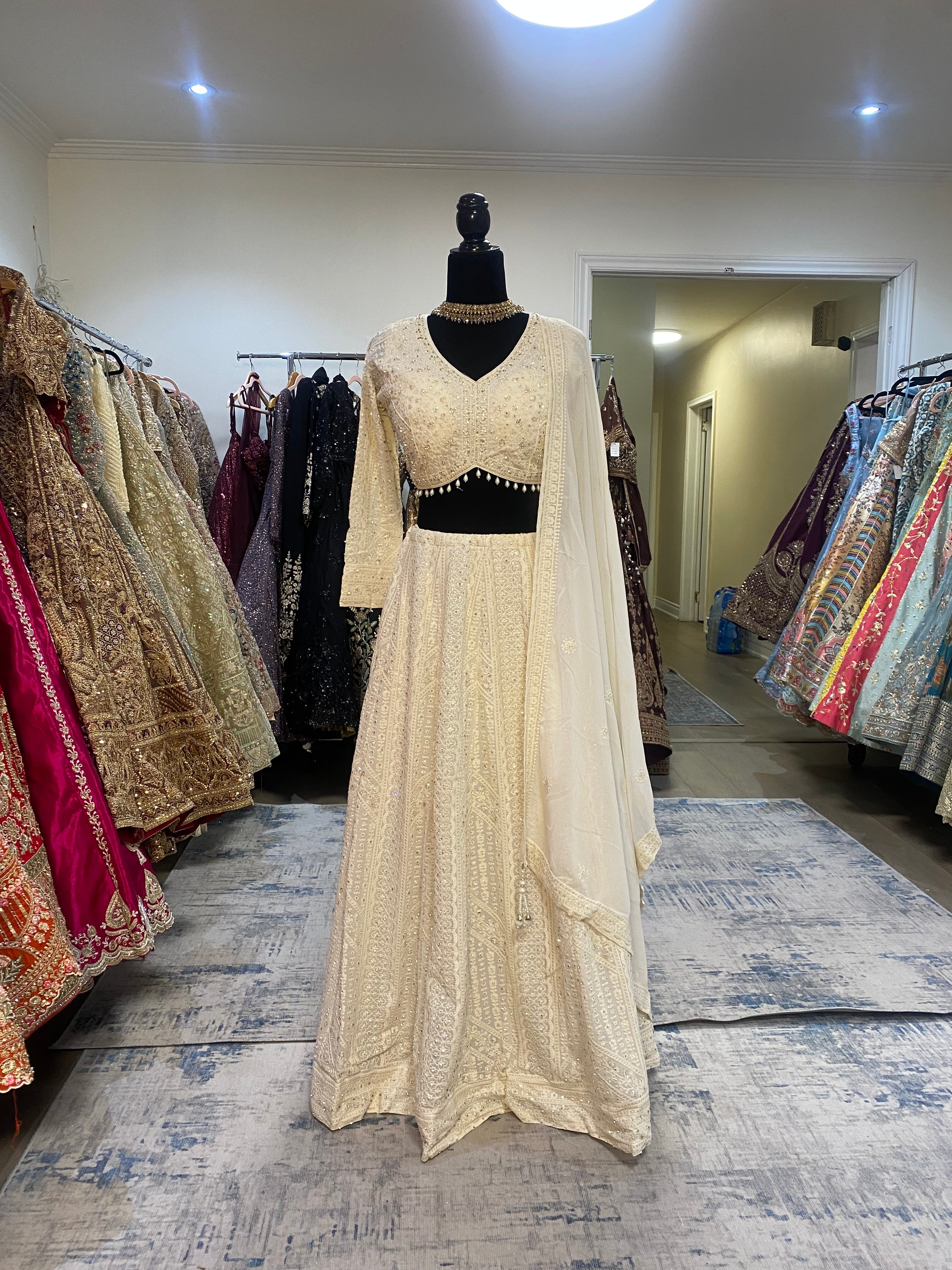 Full sleeve cream color lehenga choli